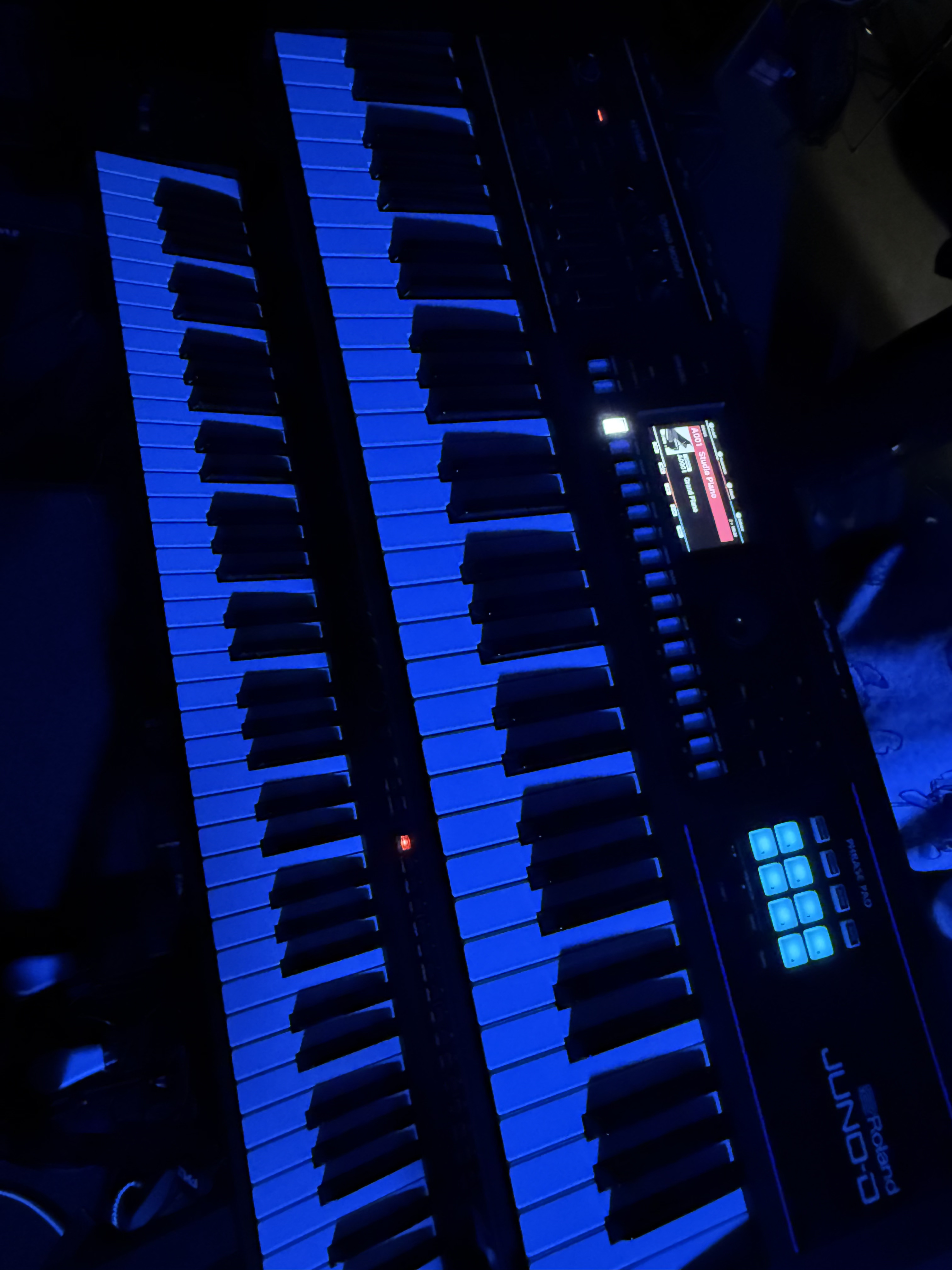 Blue-lit keyboard synthesizer
